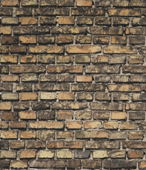 Antique old brown faded brick, closeup brick wall background, texture surface, vertical photography.