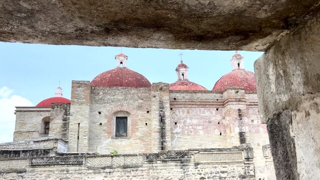 Ancient Ruins Site of Mitla Oaxaca Mexico, Dolly Low Angle View Through Stone Arch of Exterior Architectural Church Religious Monument Facade, Famous Archeological and Cultural Touristic Site