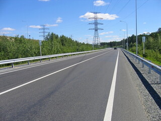 new asphalt road against the blue sky