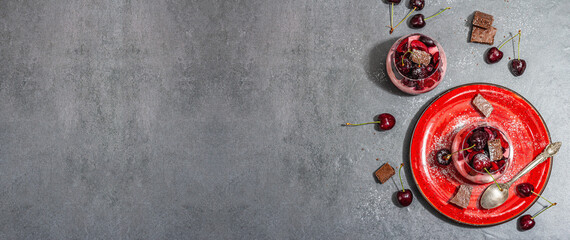Obraz na płótnie Canvas Delicious Italian dessert panna cotta with sweet cherry sauce, fresh berries and chocolate