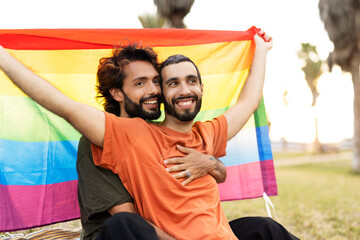 Happy couple with a pride flag. LGBT community