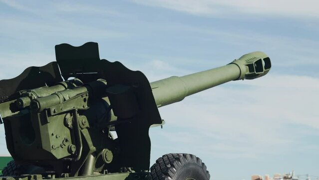 artillery piece aimed at the sky, wartime concept, conflict
