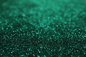 Shiny green glitter as background. Bokeh effect