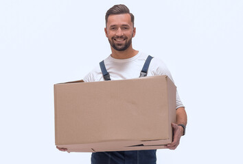 in full growth. smiling man carries a large cardboard box