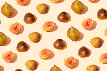 Creative pattern made with various shapes of fig on pastel background. Fresh healthy fruit concept.
