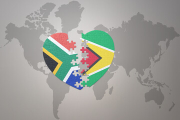 puzzle heart with the national flag of south africa and guyana on a world map background. 3D illustration