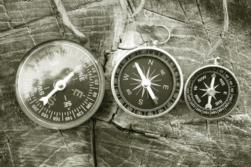 round compasses on natural background
