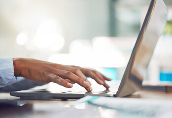 Hands typing, research and working business woman on a work laptop busy with marketing data. Online planning, web search and internet browsing black female journalist writing email or article on tech