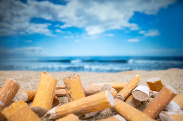 Cigarette stubs on a sandy beach