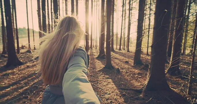 Happy Caucasian Woman enjoying, around nature, forest, tree. Female walking in woods in autumn day. Camel brown. Rusty red color. Grasses, plants, trees and parks.
