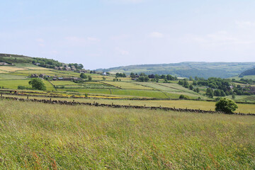 view of the calder valley in west yorkshire with village houses visible in the distance