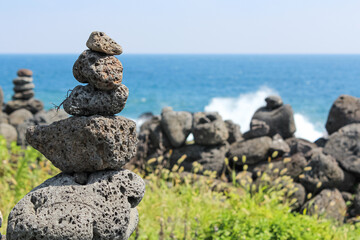 Stone tower on the beach. basalt