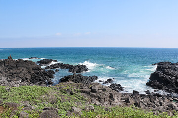 The sea seen from the shore. And the basalt of the coast