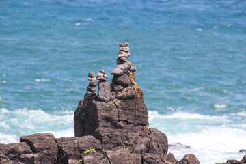 Stone tower on the beach. basalt