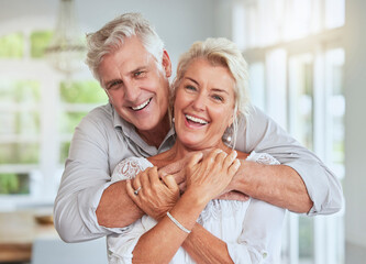 Love, couple and retirement with a senior man and woman looking happy and hugging in their home...