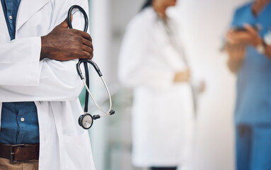 Hands, stethoscope and black man medical doctor at hospital to help, consulting research and healthcare exam. Male cardiologist professional with innovation medical tool for cardiology lab test work