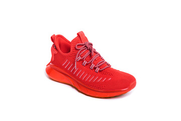 red sneaker on a teenager on a white isolated background.