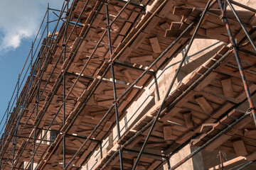 Obraz premium Scaffolding at construction site. Low angle view.