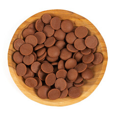 Tasty chocolate morsels isolated on white background.
