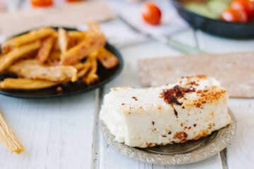 roasted paneer on a metal plate, ready to eat