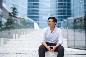 Portrait of a smiling young man in the city
