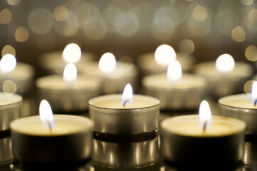 Burning candles and bokeh. Festive Christmas background