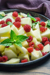 Melon raspberry summer salad with mint closeup