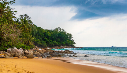 Fototapeta premium Naithon Beach bay panorama with turquoise clear water Phuket Thailand.