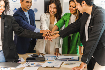 Happy working together successful team of business people mixed race teamwork join hand at office workplace.