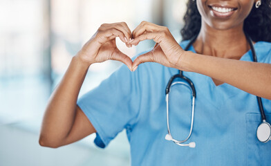 Heart hand and black woman nurse in hospital with expression to show love and care for career....