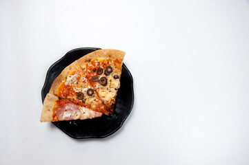 three delicious slices of pizza on the table