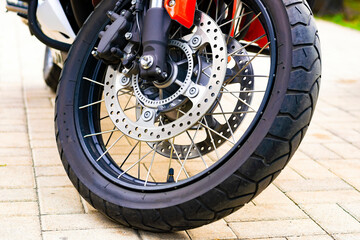 the front wheel of a sports motorcycle. brake system close-up