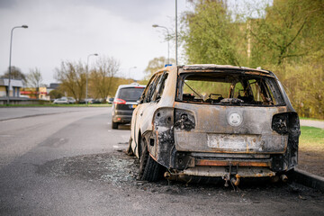 Fototapeta na wymiar Wreck of burned car on the side of the road