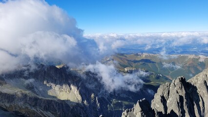 Clouds in mountains seen from the top of Lomnicki Stit in High Tatras, Slovakia