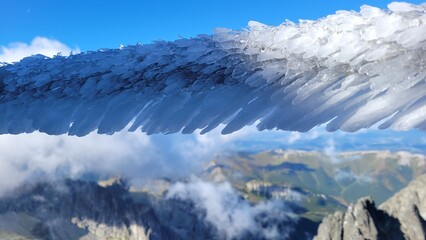Ice on the fence in mountains. Lomnicky Peak in Tatra mountains, Slovakia. High Tatras.