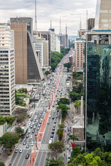Fototapeta na wymiar Beautiful aerial view of Paulista avenue, Sao Paulo city skyline. Street cityscape with modern buildings and car traffic. Concept of architecture, urban, metropolis, Brazil, South America.