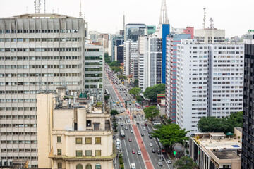 Fototapeta premium Beautiful aerial view of Paulista avenue, Sao Paulo city skyline. Street cityscape with modern buildings and car traffic. Concept of architecture, urban, metropolis, Brazil, South America.