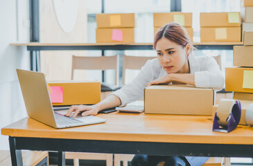 Online small business owners are sad and bored waiting for orders that haven't yet arrived. Online...