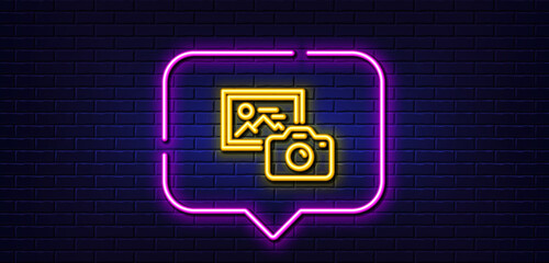 Neon light speech bubble. Photo camera line icon. Image photography sign. Picture placeholder symbol. Neon light background. Photo camera glow line. Brick wall banner. Vector