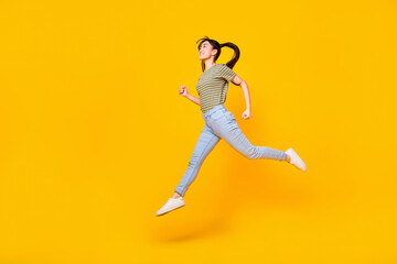Fototapeta na wymiar Full length profile side photo of charming girl running enjoy her summer trip isolated on yellow color background