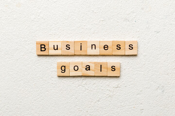 business GOAL word written on wood block. business GOAL text on cement table for your desing, concept