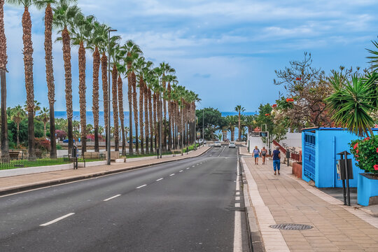 Puerto de la Cruz, Spain - November 25, 2021: View of the Atlantic Ocean from Avenida Blas Perez Gonzalez street in Puerto de la Cruz. Urban exotic landscape on the island of eternal spring