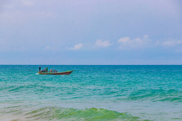 Fototapeta na wymiar Naithon Beach bay panorama with longtailboat boat fishing Phuket Thailand.