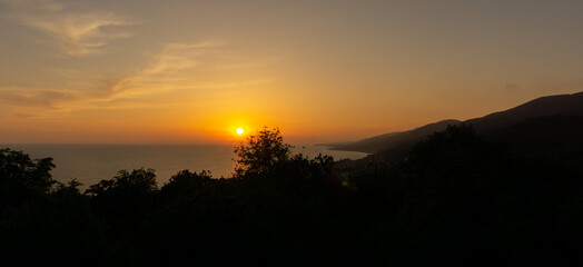 Amazing beach sunset over Black Sea. Lazarevskoye, Sochi, Russia