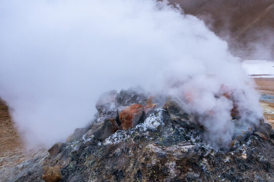 Steaming geyser in geothermal area