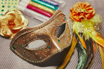 Carnival mask in the process of decoration and materials for its decoration. DIY masquerade mask...