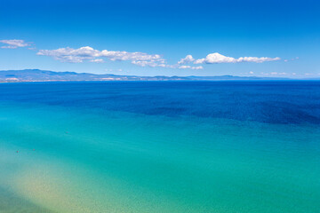 Seascape on a sunny day, view of sunny bay in Aegean sea in Chalkidiki, Greece