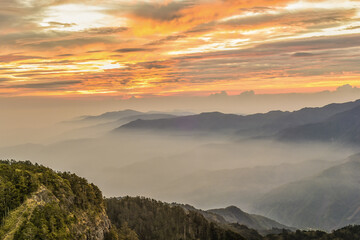 Naklejka na ściany i meble Landscape View Of The Holy Ridge And Nanhu Zhongyangjian Mountain With Amazing Sunriset On The Peak of Tao Mountaion, Wuling Quadruple Mountains Trail, Shei-Pa National Park, Taiwan