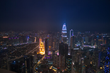 Fototapeta na wymiar Kuala Lumpur, Malaysia, 2019. Petronas twin towers at night with view on city lights