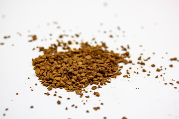 Coffee black instant on an isolated white background. Granules of instant natural coffee.